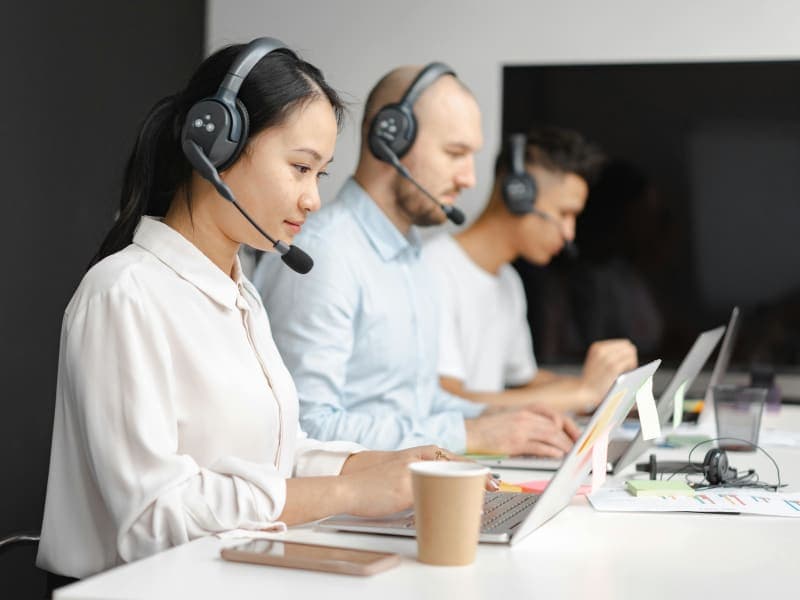 Telecom customer support professional working at modern office